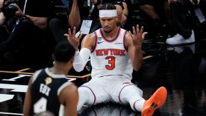 New York Knicks guard Josh Hart (3) looks towards San Antonio Spurs guard De'aaron Fox (4) after a foul during the second half of Game 1 of the NBA Finals basketball series, Wednesday, June 3, 2026, in San Antonio. (AP Photo/David J. Phillip)