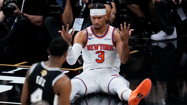 New York Knicks guard Josh Hart (3) looks towards San Antonio Spurs guard De'aaron Fox (4) after a foul during the second half of Game 1 of the NBA Finals basketball series, Wednesday, June 3, 2026, in San Antonio. (AP Photo/David J. Phillip)