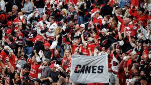 Carolina Hurricanes fans celebrate after an overtime victory against the Vegas Golden Knights in Game 2 of the NHL hockey Stanley Cup Final series in Raleigh, N.C., Thursday, June 4, 2026. (AP Photo/Ben McKeown)