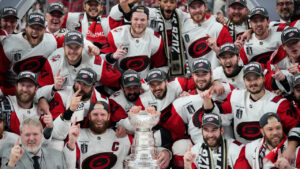 The Carolina Hurricanes pose for photos after a win over the Vegas Golden Knights in Game 6 of the NHL hockey Stanley Cup Final series, Sunday, June 14, 2026, in Las Vegas. (John Locher/AP)