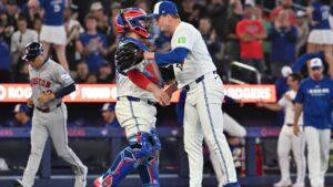 Toronto Blue Jays pitcher Louie Varland, right, and Toronto Blue Jays catcher Alejandro Kirk celebrate their team's victory over the Houston Astros in MLB baseball action in Toronto, Monday, June 22, 2026. (Jon Blacker/CP)