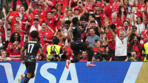 Jonathan David celebrates after scoring Canada's second goal against Qatar. (Abbie Parr/AP)
