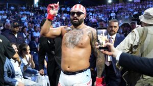 Josh Hokit leaves the ring after winning his fight against Derrick Lewis in a heavyweight bout during UFC Freedom 250 on the South Lawn of the White House, Sunday, June 14, 2026, in Washington. (Alex Brandon/AP)