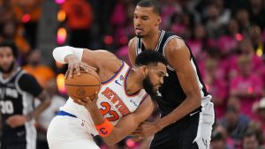 New York Knicks centre Karl-Anthony Towns (32) looks to drive past San Antonio Spurs forward Victor Wembanyama during the first half of Game 1 of the NBA Finals basketball series, Wednesday, June 3, 2026, in San Antonio. (Eric Gay/AP)