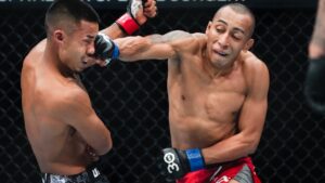 Peru's Kevin Borjas seen punching Joshua Van during their 2023 UFC flyweight fight. (AP Photo/Frank Franklin II)