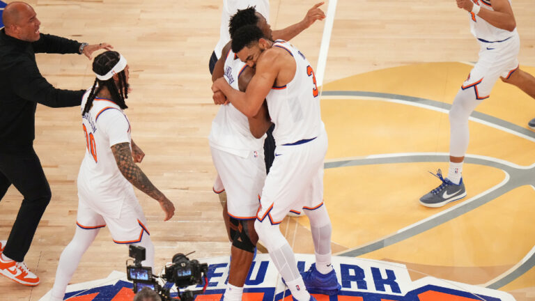 New York Knicks centre Karl-Anthony Towns (32) hugs forward Og Anunoby (8) after the team's victory over the San Antonio Spurs in Game 4 of the NBA Finals basketball series, Wednesday, June 10, 2026, in New York. (Frank Franklin II/AP)