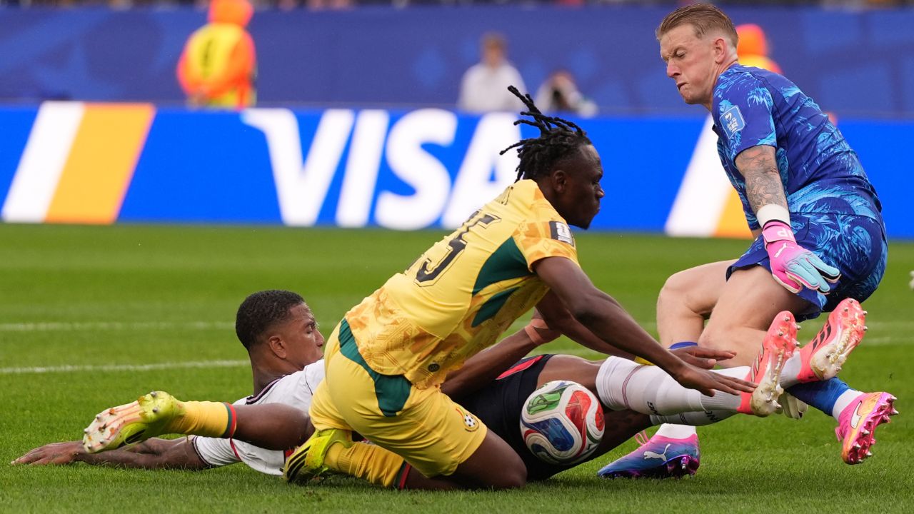 England's Ezri Konsa (2) clears the ball in front pf Ghana's Prince Adu (25) during the World Cup Group L soccer match between England and Ghana in Foxborough, Mass., near Boston, Tuesday, June 23, 2026. (Charlie Krupa/AP)