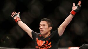 Kyoji Horiguchi celebrates after defeating Louis Gaudinot during their flyweight mixed martial arts bout at UFC 182, Saturday, Jan. 3, 2015, in Las Vegas. (AP Photo/John Locher)