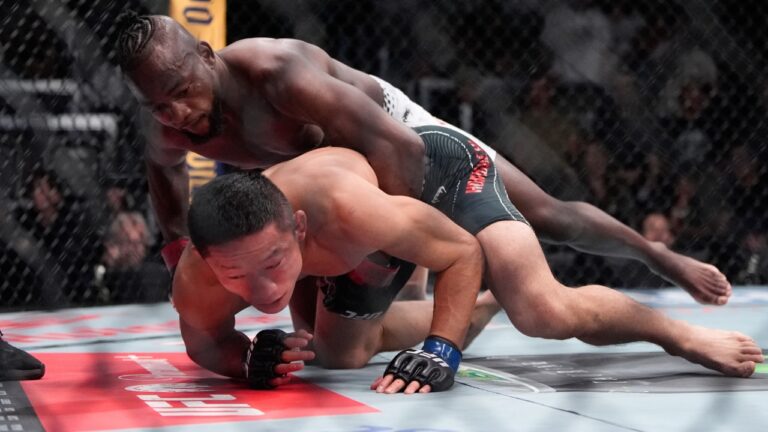 Manel Kape, top, fights Kyoji Horiguchi during their flyweight bout at a UFC Fight Night mixed martial arts event Saturday, June 20, 2026, in Las Vegas. (AP Photo/John Locher)