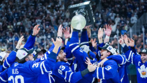 Toronto Marlies forward Logan Shaw (11) lifts the Calder Cup to celebrate with his teammates after winning Game 5 of the AHL Calder Cup Final over the Chicago Wolves in Toronto on Friday, June 19, 2026. (Arlyn McAdorey/CP)