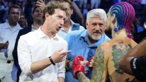 Meta CEO Mark Zuckerberg congratulates Sean O'Malley after he won his his fight against Aiemann Zahabi during their bantamweight bout at UFC Freedom 250 on the South Lawn of the White House, Sunday, June 14, 2026, in Washington. (AP Photo/Alex Brandon)