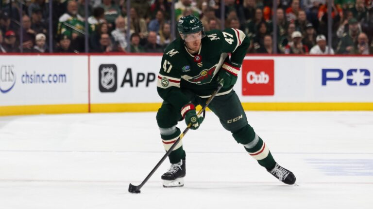 Minnesota Wild's Michael McCarron (47) controls the puck against the Anaheim Ducks during the third period of an NHL hockey game Tuesday, April 14, 2026, in St. Paul, Minn. (Lily Dozier/AP)