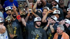 New York Knicks guard Jalen Brunson holds the MVP trophy after the Knicks defeated the San Antonio Spurs in Game 5 of the NBA Finals basketball series, Saturday, June 13, 2026, in San Antonio. (Ross D. Franklin/AP)