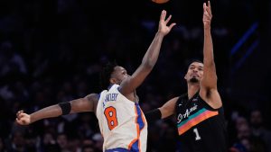 New York Knicks' OG Anunoby, left, blocks a pass headed for San Antonio Spurs' Victor Wembanyama during the first half of an NBA basketball game Sunday, March 1, 2026, in New York. (Seth Wenig/AP)