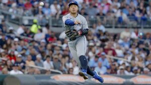 Toronto Blue Jays third baseman Kazuma Okamoto (7) fields a single hit by Atlanta Braves' Ronald Acuna Jr. during the third inning of a baseball game, Thursday, June 4, 2026, in Atlanta. (AP Photo/Erik S. Lesser)