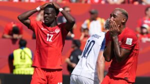 Tani Oluwaseyi and teammate Derek Cornelius react after a chance to score was missed during the World Cup match between Canada and Bosnia. (Stephanie Scarbrough/AP)