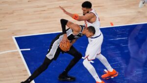 San Antonio Spurs forward Victor Wembanyama, left, tries to drive past New York Knicks center Karl-Anthony Towns during Game 3 of the NBA Finals basketball series, Monday, June 8, 2026, in New York. (Yuki Iwamura/AP)