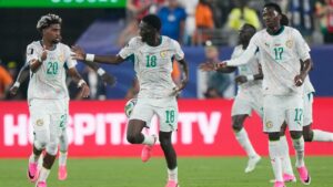 Senegal's Ismaila Sarr (18) celebrates with teammates after scoring their third goal during the World Cup Group I soccer match between Norway and Senegal in East Rutherford, N.J., near New York, Monday, June 22, 2026. (AP Photo/Steve Luciano)