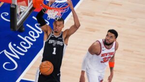 San Antonio Spurs centre Victor Wembanyama (1) dunks as New York Knicks centre Karl-Anthony Towns (32) looks on during the second half of Game 3 of the NBA Finals basketball series, Monday, June 8, 2026, in New York. (Yuki Iwamura/AP)