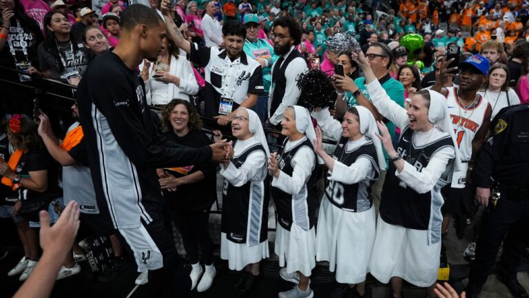 The Salesian Sisters greet players prior to Game 1 of the NBA Finals basketball series between the New York Knicks and the San Antonio Spurs, Wednesday, June 3, 2026, in San Antonio. (AP Photo/Eric Gay)