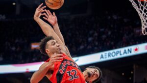 Toronto Raptors forward Trayce Jackson-Davis (32) is fouled by Indiana Pacers guard Ben Sheppard (back) as he soars in for a dunk during second half NBA action in Toronto, Sunday, Feb. 8, 2026. (Frank Gunn/CP)