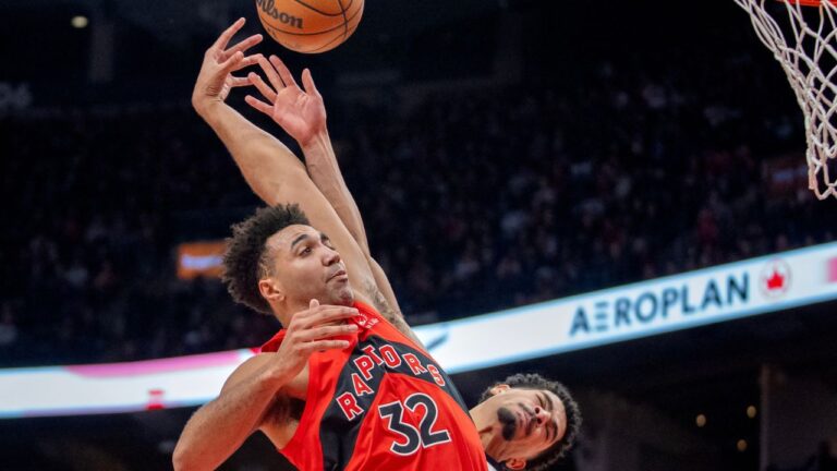 Toronto Raptors forward Trayce Jackson-Davis (32) is fouled by Indiana Pacers guard Ben Sheppard (back) as he soars in for a dunk during second half NBA action in Toronto, Sunday, Feb. 8, 2026. (Frank Gunn/CP)