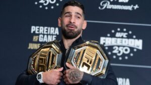 UFC lightweight champion Ilia Topuria, holds his championship belts during the UFC Freedom 250 media day, Wednesday, June 10, 2026, in Washington. (Manuel Balce Ceneta/AP)