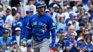 Toronto Blue Jays' George Springer yells after he scores during the eighth inning of a baseball game against the Chicago Cubs, Saturday, June 20, 2026, in Chicago. (Matt Marton/AP)