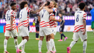 United States' Giovanni Reyna, centre, is congratulated by teammates after scoring his team's fourth goal during the World Cup Group D soccer match between the United States and Paraguay in Inglewood, Calif., near Los Angeles, Friday, June 12, 2026. (Mark J. Terrill/AP)