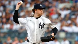 New York Yankees pitcher Cam Schlittler throws against the Cincinnati Reds during the first inning of a baseball game, Friday, June 19, 2026, in New York. (AP Photo/Noah K. Murray)