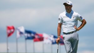 Corey Conners, of Canada, waits to putt on the first hole during the third round of the U.S. Open golf tournament at Shinnecock Hills Golf Club in Southampton, N.Y., Saturday, June 20, 2026.(AP Photo/David J. Phillip)