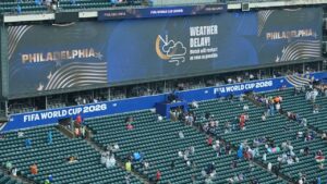 A sign advising fans of a weather delay is displayed during the World Cup Group I soccer match between France and Iraq in Philadelphia, Monday, June 22, 2026. (AP Photo/Matt Rourke)