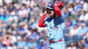 Toronto Blue Jays pitcher Dylan Cease (84) reacts after allowing three walks during first inning American League MLB baseball action against the Texas Rangers, in Toronto, Saturday, June 27, 2026. THE CANADIAN PRESS/Nathan Denette