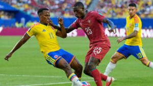 Colombia's Jhon Arias (11) and Portugal's Nuno Mendes (25) battle for the ball during the World Cup Group K soccer match between Colombia and Portugal in Miami Gardens, Fla., Saturday, June 27, 2026. (AP Photo/Rebecca Blackwell)