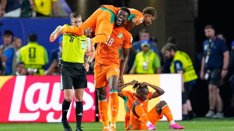 Ivory Coast's Ibrahim Sangare (18) carries teammate Amad Diallo (15) as they celebrate following their win in their World Cup Group E soccer match against Ecuador in Philadelphia, Sunday, June 14, 2026. (AP Photo/Petr David Josek)