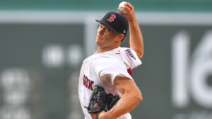 Boston Red Sox's Sonny Gray winds up for a pitch to a New York Yankees batter in the first inning of a baseball game, Sunday, June 28, 2026, in Boston. (AP Photo/Steven Senne)