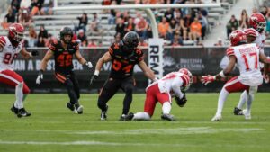 Calgary Stampeders' Erik Brooks (87) catches a B.C. Lions onside kick in front of Lions' Zander Horvath (34) during second half CFL football action in Kelowna, B.C., on Saturday, June 27, 2026. THE CANADIAN PRESS/Steve Dunsmoor