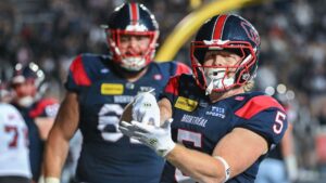 Montreal Alouettes' Travis Theis (5) reacts after scoring a touchdown during second half CFL football action against the Ottawa Redblacks' in Montreal, on Sunday, June 28, 2026. THE CANADIAN PRESS/Graham Hughes
