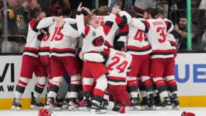 The Carolina Hurricanes celebrates after a win over the Vegas Golden Knights in Game 6 of the NHL hockey Stanley Cup Final series against the Vegas Golden Knights, Sunday, June 14, 2026, in Las Vegas. (AP Photo/John Locher)