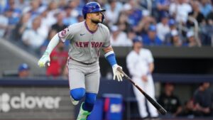 New York Mets third baseman Bo Bichette (19) watches his ball as he flies out during first inning American League MLB baseball action against the Toronto Blue Jays, in Toronto, Monday, June 29, 2026. THE CANADIAN PRESS/Nathan Denette