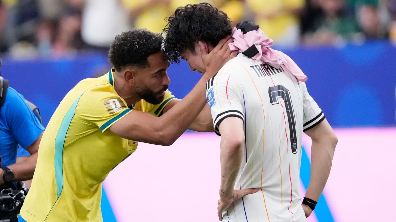 Brazil's Matheus Cunha (9) consoles Japan's Ao Tanaka (7) at the end of the World Cup round of 32 soccer match between Brazil and Japan in Houston, Monday, June 29, 2026. (AP Photo/David J. Phillip)