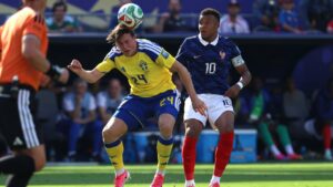 Sweden's Elliot Stroud (24) heads the ball against France's Kylian Mbappe (10) during the World Cup round of 32 soccer match between France and Sweden in East Rutherford, N.J., near New York, Tuesday, June 30, 2026. (AP Photo/Pamela Smith)