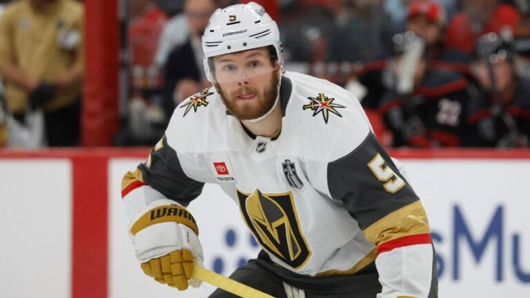 Vegas Golden Knights' Jeremy Lauzon (5) watches the puck against the Carolina Hurricanes during the first period in Game 5 of the NHL hockey Stanley Cup Final series in Raleigh, N.C., Thursday, June 11, 2026. (AP Photo/Karl DeBlaker)
