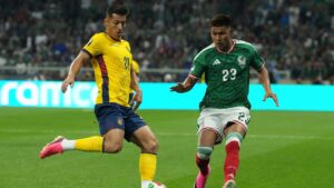 Ecuador's Alan Franco (21), left, challenges for the ball with with Mexico's Guillermo Martinez (22) during the World Cup round of 32 soccer match between Mexico and Ecuador in Mexico City, Tuesday, June 30, 2026. (AP Photo/Eduardo Verdugo)
