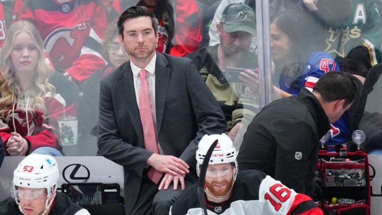 New Jersey Devils assistant coach Jeremy Colliton looks on during the third period of an NHL hockey game between the Dallas Stars and the New Jersey Devils, Tuesday, March 24, 2026, in Dallas. (AP Photo/Julio Cortez)