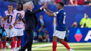 France's Kylian Mbappe celebrates with head coach Didier Deschamps after scoring his side's third goal against Senegal in East Rutherford, N.J., near New York, Tuesday, June 16, 2026. (Frank Franklin II/AP)