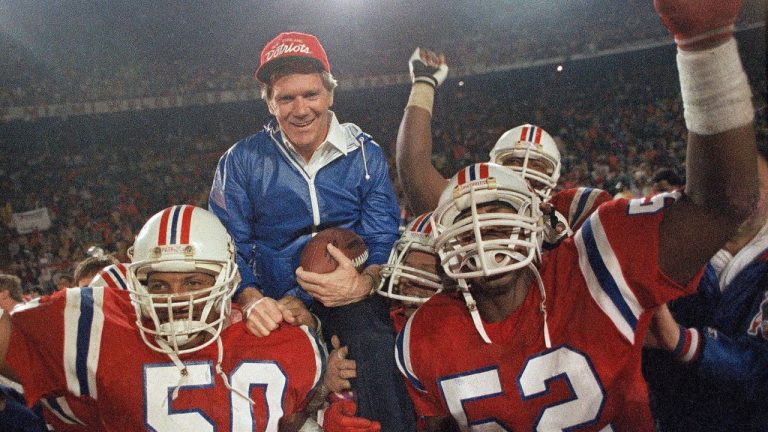 In this Jan. 12, 1986, file photo, New England Patriots coach Raymond Berry gets a victory ride from players Larry McGrew and Johnny Rembert after the Patriots defeated the Miami Dolphins 31-14 in the NFL football AFC playoffs in Miami. The football that Johnny Unitas threw to Raymond Berry for a touchdown in the historic 1958 NFL Championship game is being sold at auction. The ball has an estimated value of $40,000-$70,000. (AP)