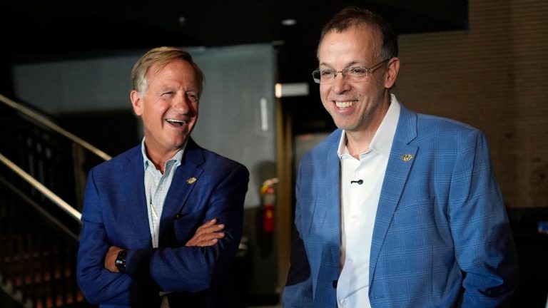 Nashville Predators owner Bill Haslam, left, and new president of hockey operations and general manager Chris MacFarland, right, arrive for his introductory news conference at the NHL team's facility Wednesday, June 3, 2026, in Nashville, Tenn. (George Walker IV/AP)