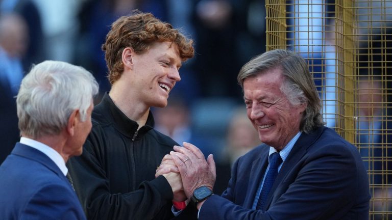 Jannik Sinner, of Italy, is congratulated by former tennis champion Adriano Panatta, right, after defeating Casper Ruud, of Norway, in the final match to win the Italian Open tennis tournament, in Rome, Sunday, May 17, 2026. (Andrew Medichini/AP)