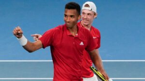 Canada's Denis Shapovalov and teammate Felix Auger-Aliassime, left, celebrate after defeating Britain's Jamie Murray and Joe Salisbury in their match at the ATP Cup tennis tournament in Sydney, Australia, Tuesday, Jan. 4, 2022. (AP-Mark Baker/CP)
